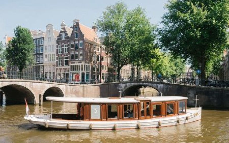 Canal cruise in a classic boat in Amsterdam
